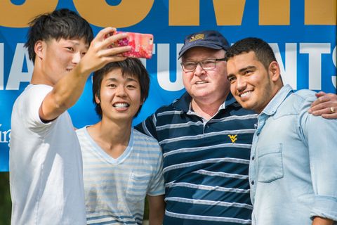 International students take a selfie with Tom Sloane.