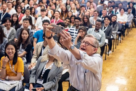 President Gee snaps a selfie with the audience