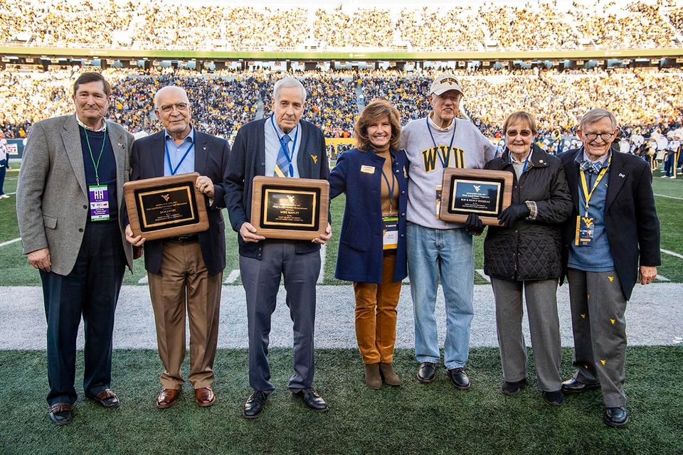 Most Loyal award winners pose for a picture with President Gee at the Nov. 6, 2021, football game against Oklahoma State.
