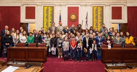 Participants pose for group photo in House chamber