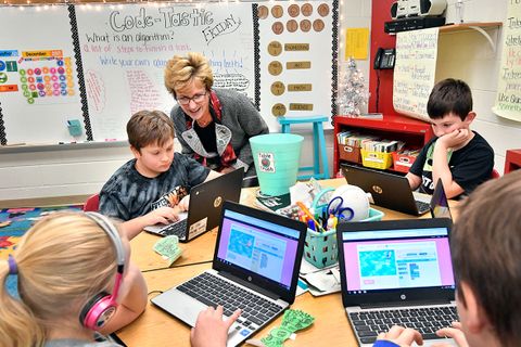 Gayle Manchin talks to third graders during The Hour of Code