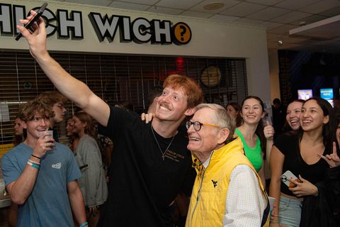 President Gee takes a selfie with a student at the first WVUp All Night of the year.