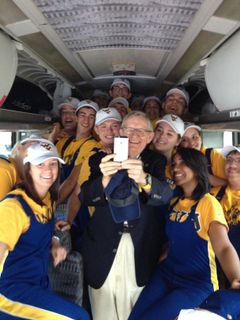 President Gee takes a selfie on a WVU band bus.