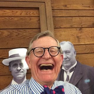 President Gee takes a selfie in front of Smith and Lever cut-outs