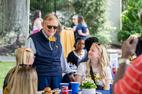 President Gee visits with new commuter students attending the picnic at Blaney House.